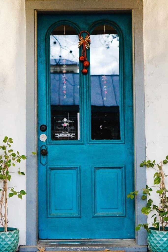blue door with transparent glass